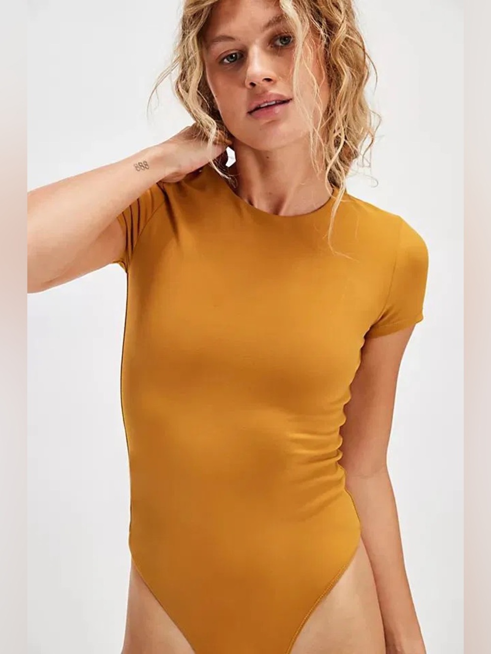Free People Alexis Tee Bodysuit in a mustard